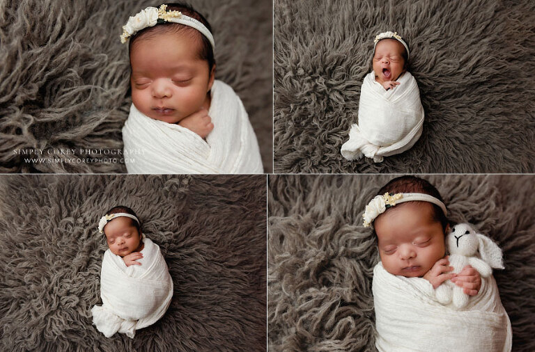 newborn photographer near Newnan, baby girl in ivory wrap on flokati