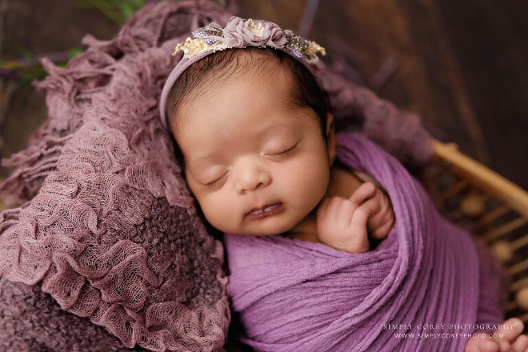 Newnan newborn photographer, baby girl in purple studio set 