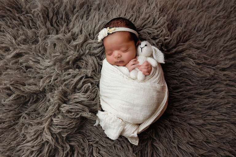 Atlanta newborn photographer, baby girl in ivory wrap with bear