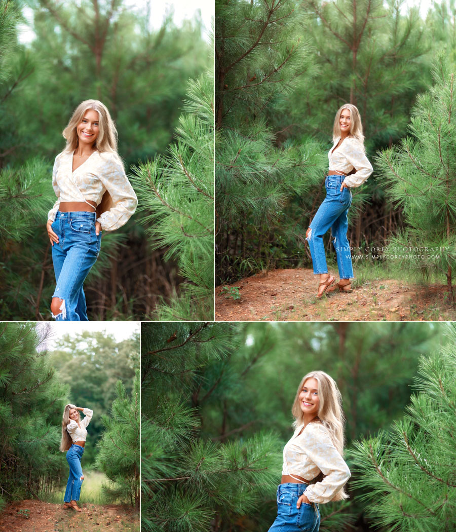 senior portrait photographer near Douglasville, teen girl in jeans outside in pine trees