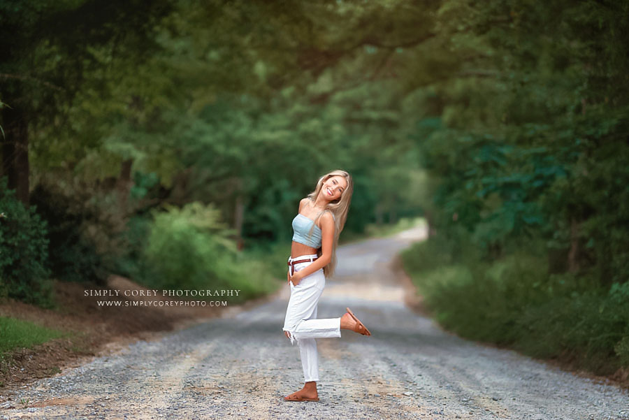 senior portraits near Carrollton, GA; teen girl outside on dirt road