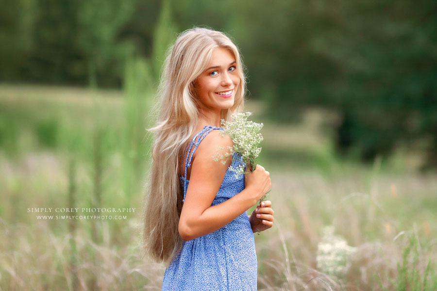 Tyrone senior portrait photographer, teen girl in blue dress outside in field