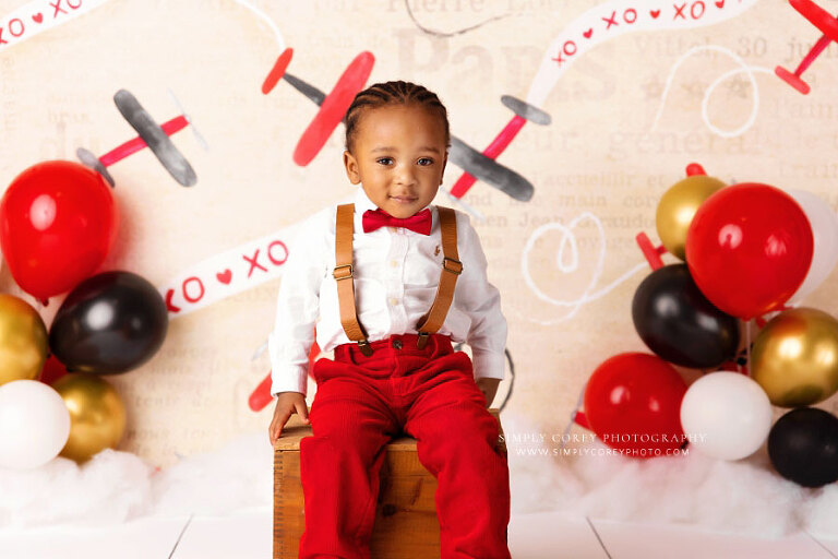 baby photographer near Carrollton, GA; valentine airplane milestone session