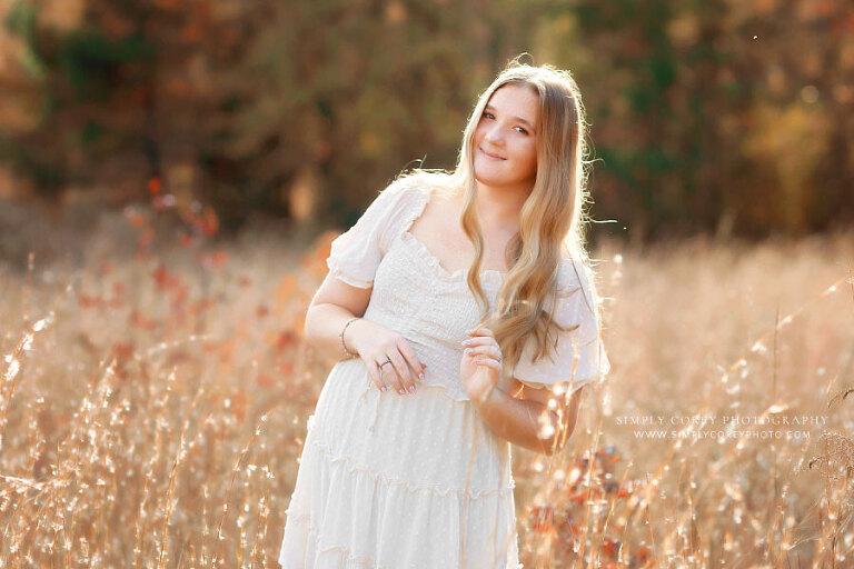 Atlanta senior portrait photographer, teen girl with long hair in field of tall grass