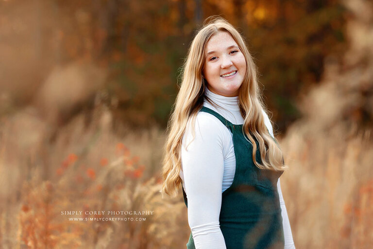 Carrollton senior portrait photographer in Georgia, teen girl in field with tall grass