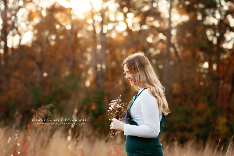 Tyrone senior portrait photographer, teen girl with flowers in a field outside