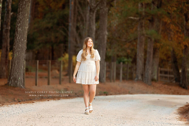 Tyrone senior portrait photographer, teen girl walking on dirt road
