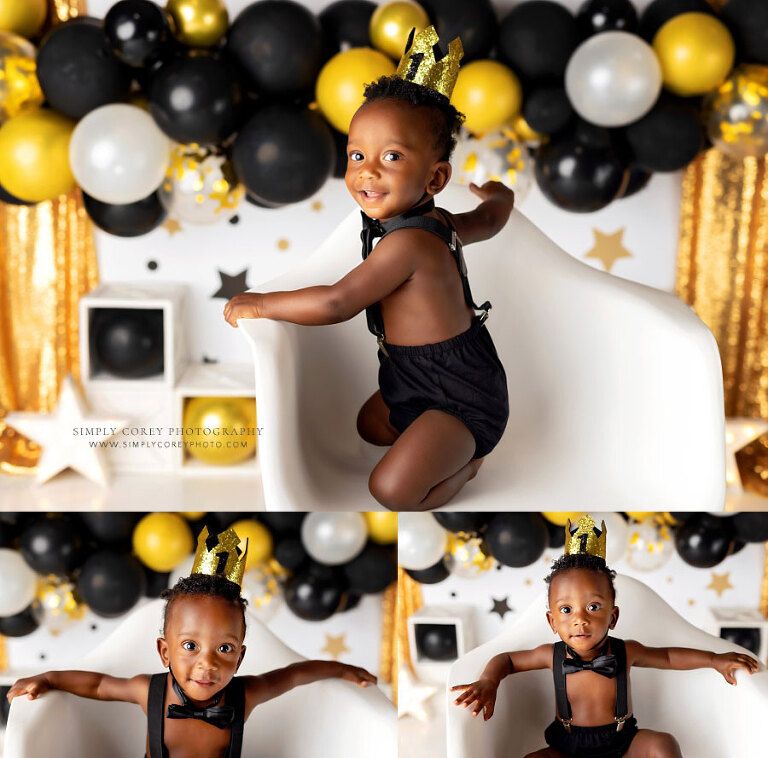 baby photographer near Dallas, GA; boy in crown on chair on studio milestone set