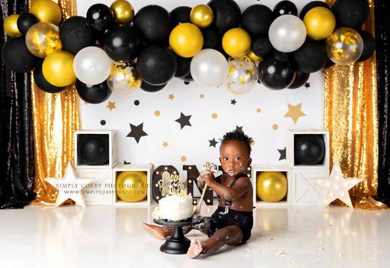 Hiram cake smash photographer, baby on black and gold Mr. Onederful set