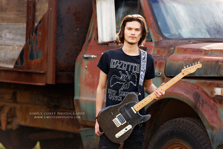 Atlanta senior portrait photographer, teen with guitar by old truck