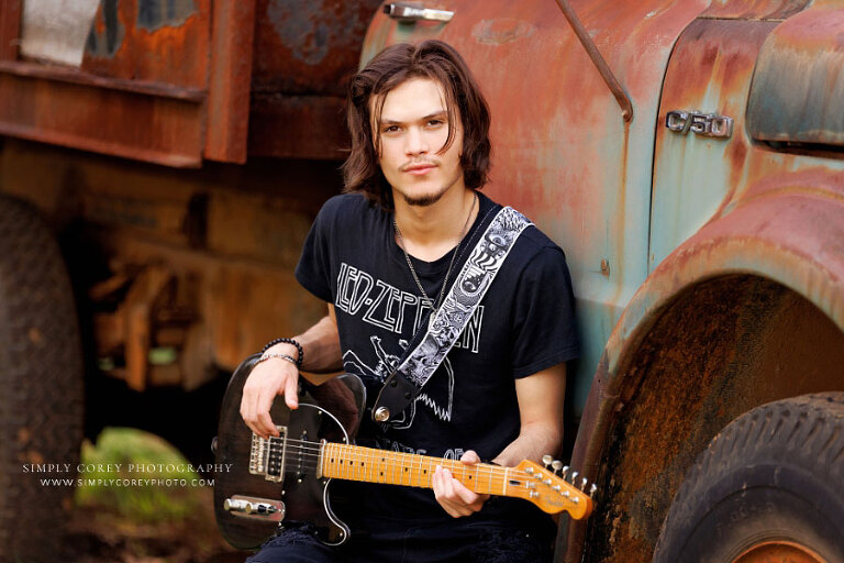 Bremen senior portrait photographer, teen outside with old truck and guitar