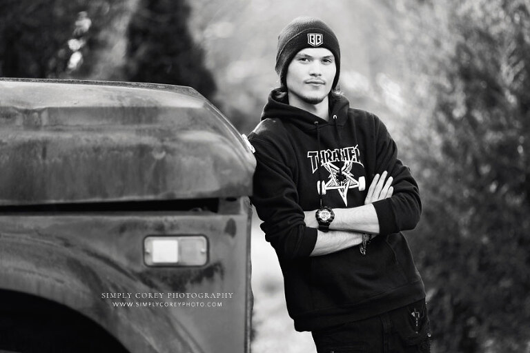 Douglasville senior portrait photographer, teen with old truck in black and white