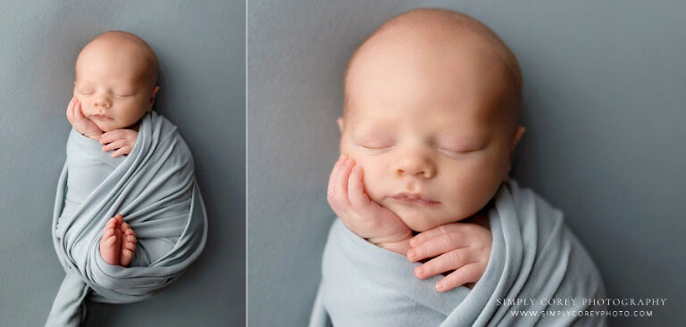 Hiram newborn photographer, baby boy with blue swaddle and backdrop