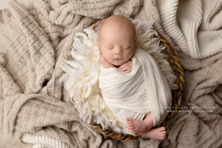 newborn photographer near Atlanta, baby boy in basket with neutral colored wrap and blankets