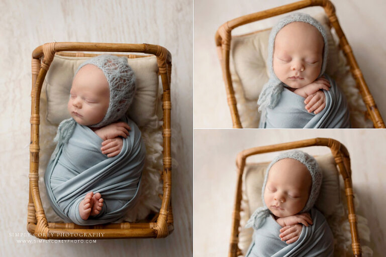 Tyrone newborn photographer, baby boy in blue swaddle set with rattan bed