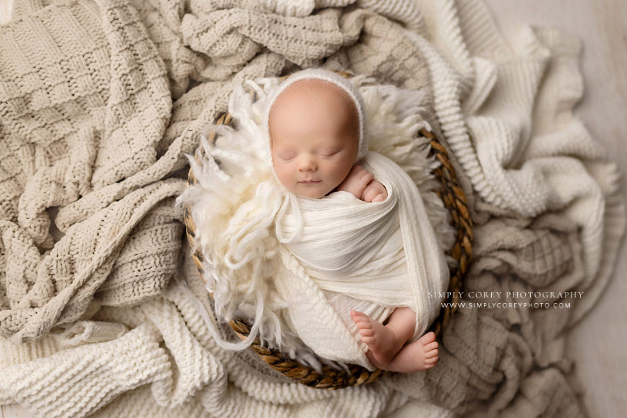 Villa Rica newborn photographer, baby boy in basket with neutral swaddle and blankets