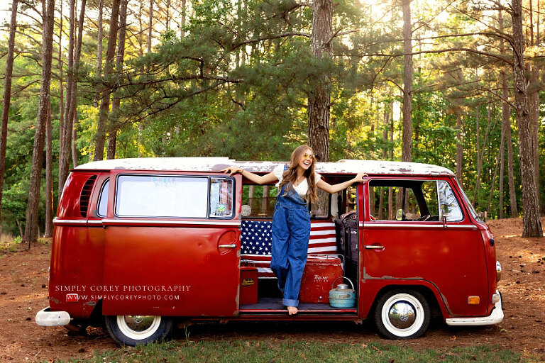 senior portrait photographer near Atlanta, teen girl in overalls with red VW Bus