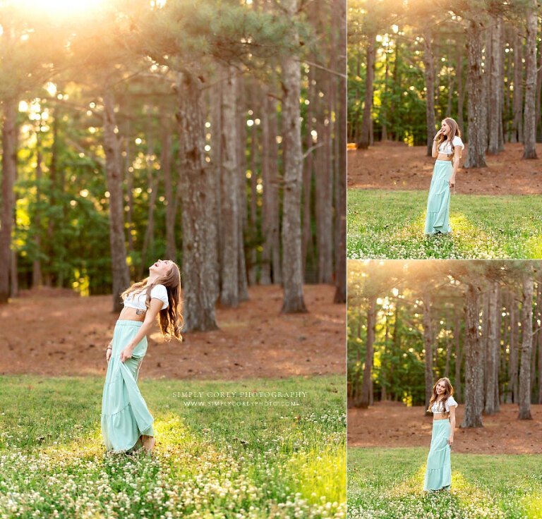 senior portrait photographer near Newnan, teen girl outside in clover and sunlight