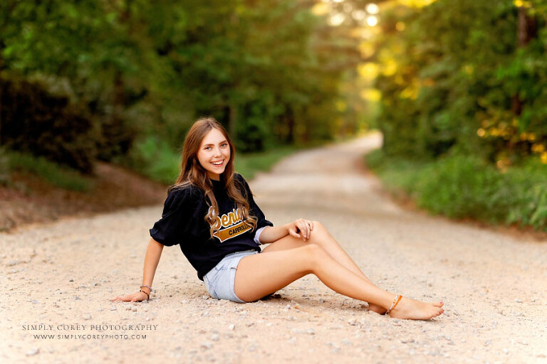 Villa Rica senior portrait photographer, teen girl sitting outside on country road