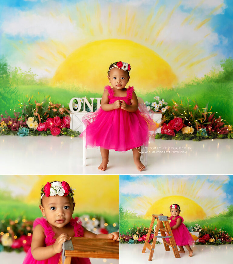 baby photographer near Austell, girl in pink dress on sunshine studio set