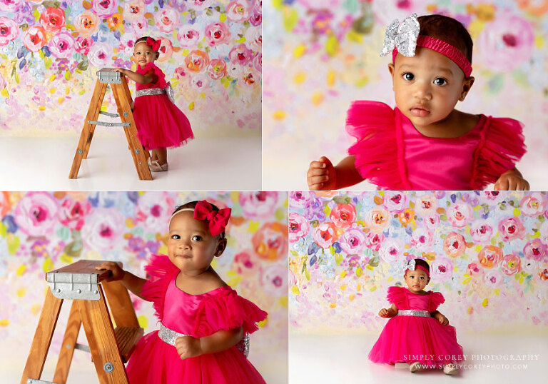 Fairburn baby photographer, girl on floral backdrop with bright colors