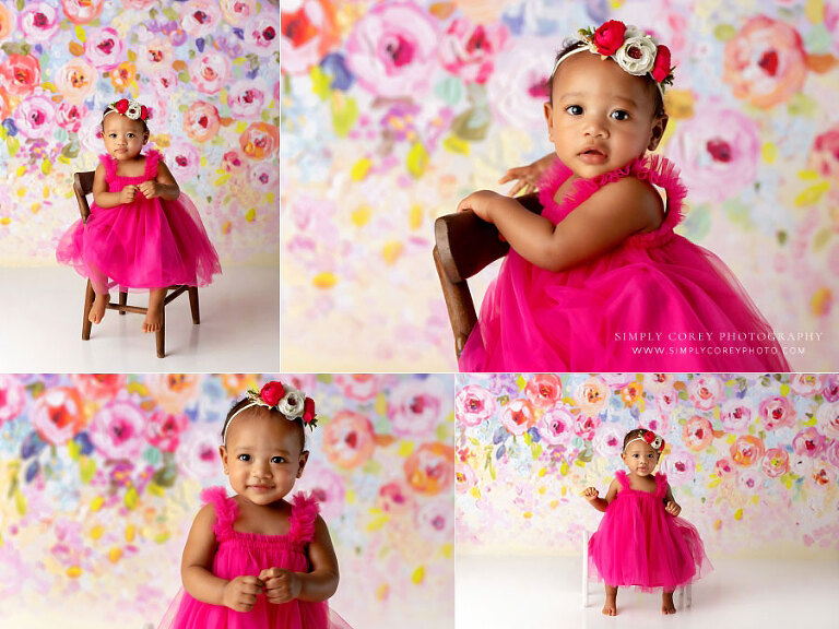 Mableton baby photographer, girl in pink dress on colorful studio backdrop