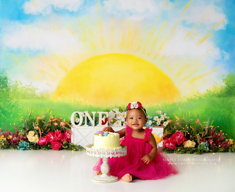 Atlanta cake smash photographer, baby in pink with yellow sunshine studio set