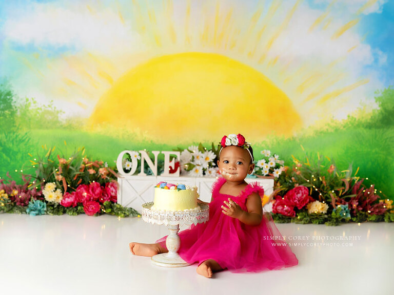 Hiram cake smash photographer, baby on vibrant sunshine studio set