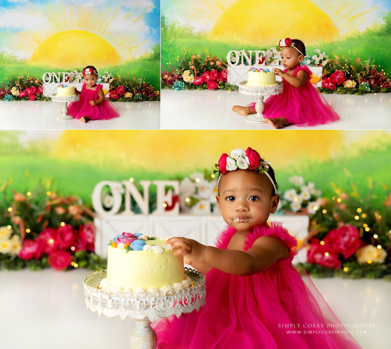 Newnan cake smash photographer, baby in pink dress with sunshine studio set 
