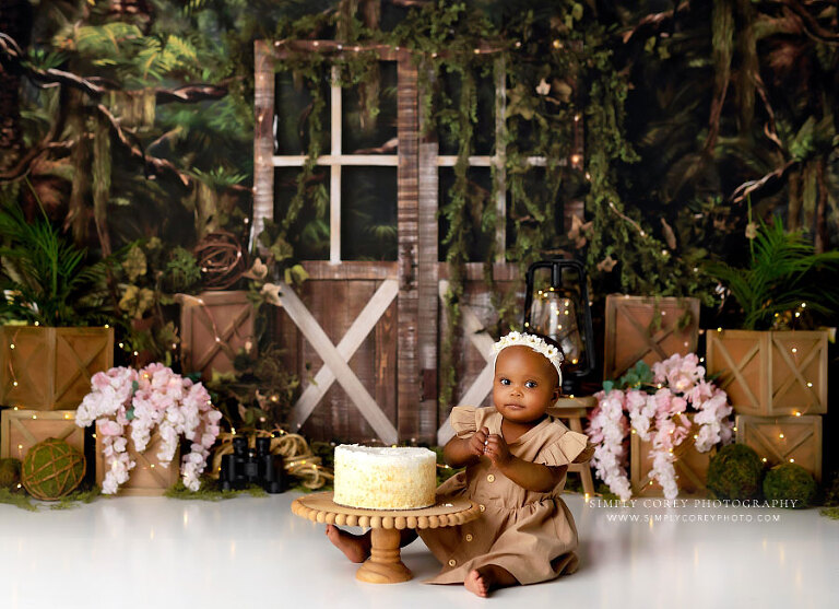 cake smash photographer near Dallas, GA; baby girl on explorer studio set