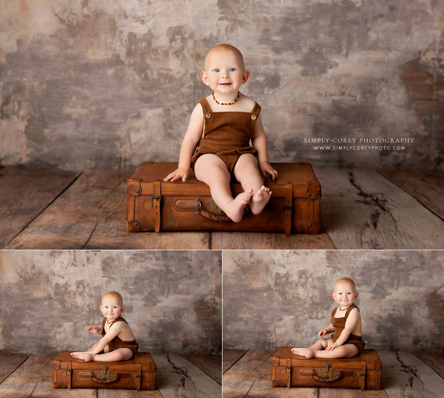 Bremen baby photographer, boy sitting on suitcase in studio