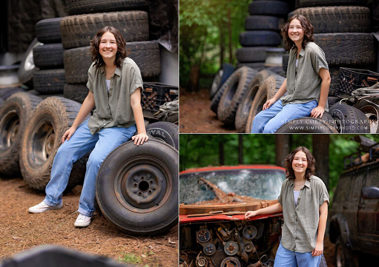 senior portraits near Villa Rica, teen girl outside with tires and vehicles