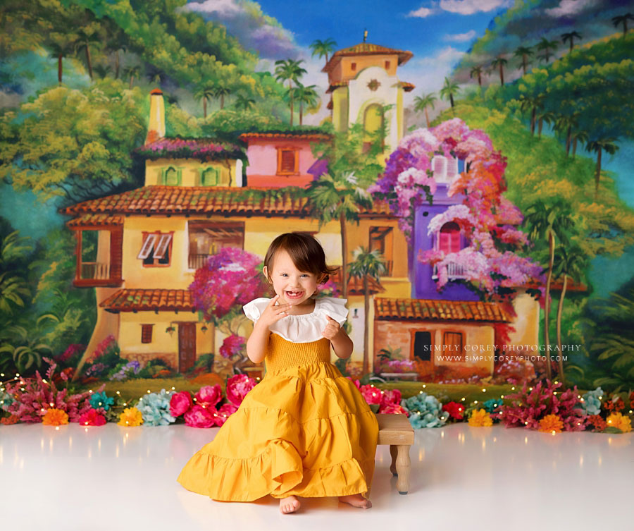 Atlanta baby photographer, girl laughing on La Casita studio cake smash set