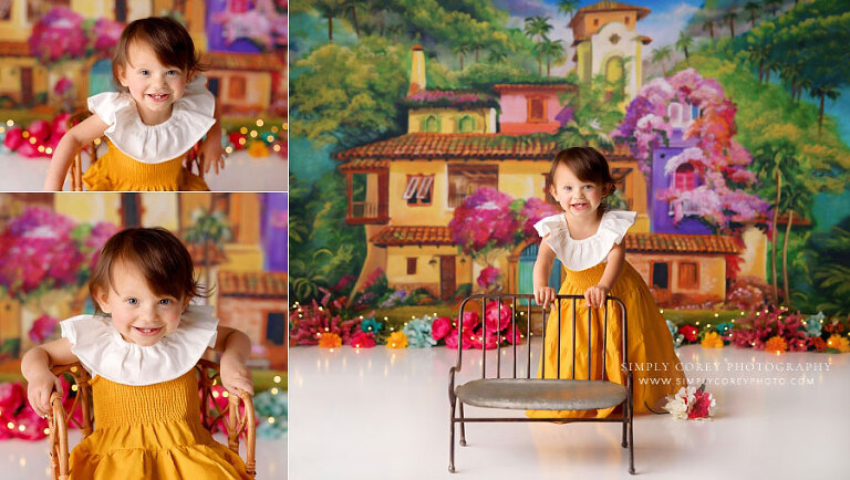baby photographer near Bremen, girl in yellow dress on La Casita studio set