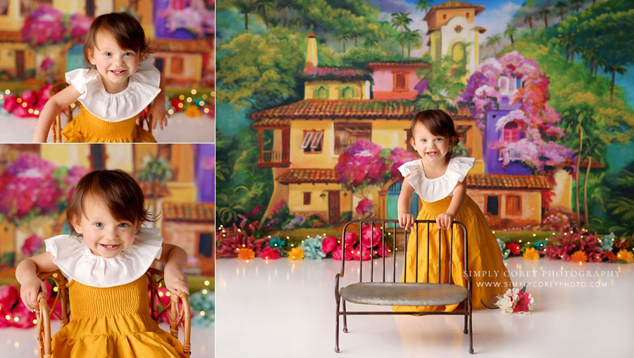 baby photographer near Bremen, girl in yellow dress on La Casita studio set
