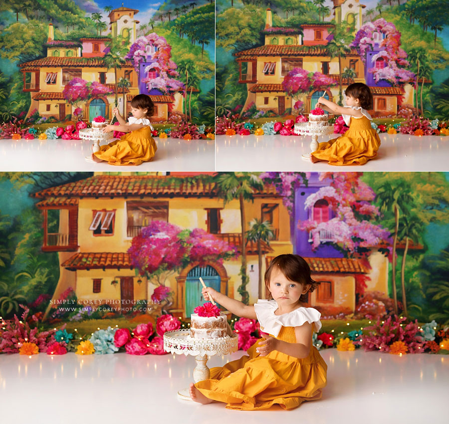 cake smash photographer near Douglasville, baby girl with wooden spoon and naked cake on la casita set