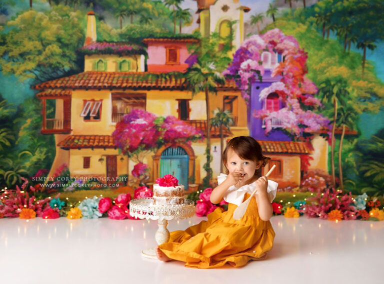 Powder Springs cake smash photographer, baby girl in yellow dress for encanto-inspired theme