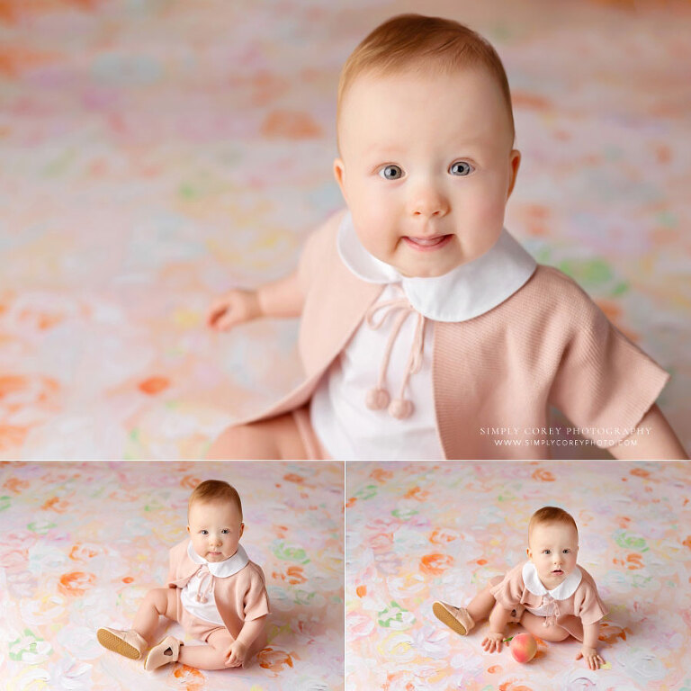 Douglasville baby photographer, girl in pink cardigan for first birthday