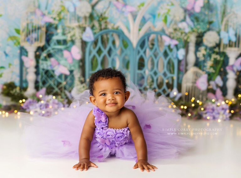 baby photographer near Atlanta, butterfly dress on blue and purple studio set