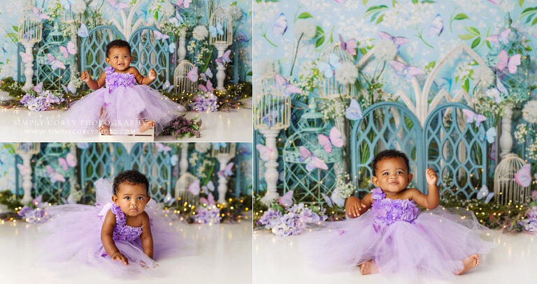 baby photographer near Douglasville, girl in purple butterfly dress on floral studio set
