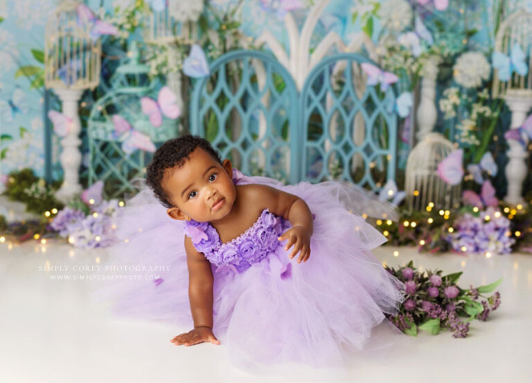 Powder Springs baby photographer, girl in purple dress on floral butterfly set