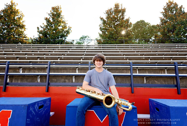 Atlanta senior portrait photographer, teen with saxophone at Milton High School