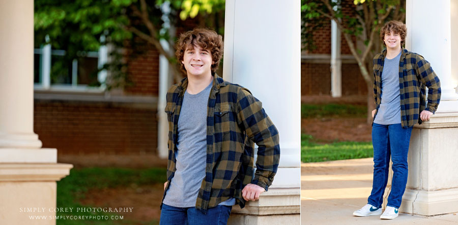 senio rportrait photographer near Newnan, teen outside near columns at school