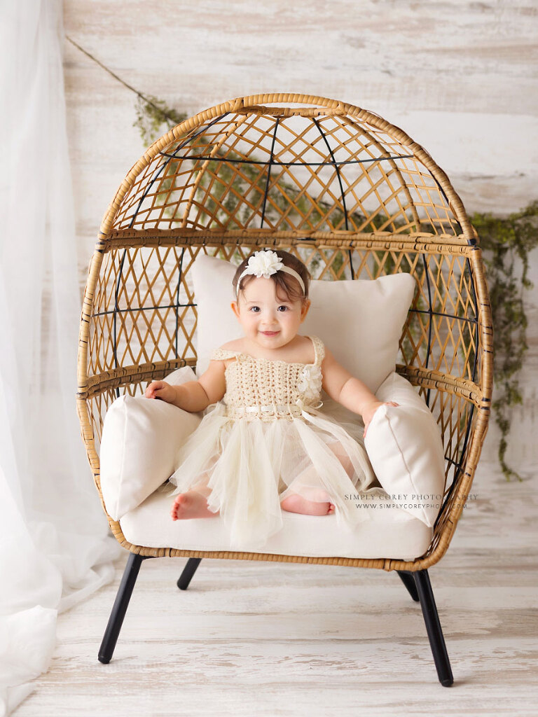 Tyrone baby photographer, boho milestone session with wicker egg chair