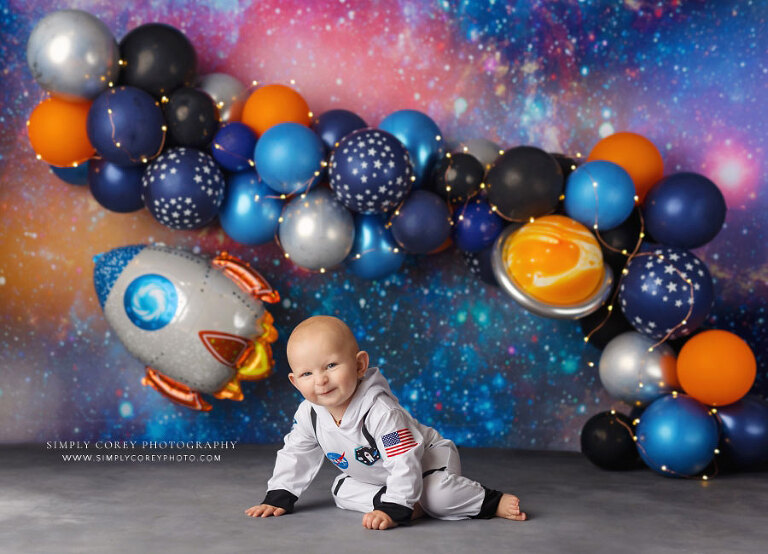 baby photographer near Villa Rica, colorful outer space studio set with balloons