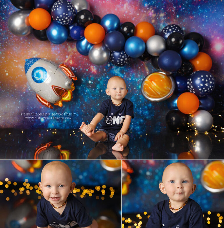 Douglasville baby photographer, boy in one shirt on outer space studio set with balloons