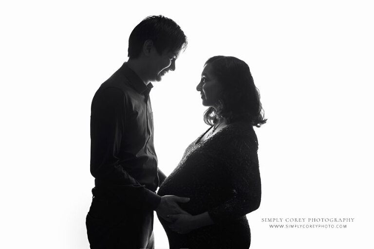 maternity photographer near Tyrone, black and white silhouette studio couples portrait
