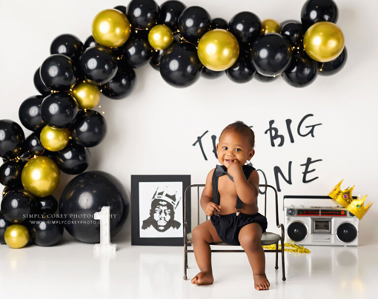 baby photographer near Atlanta, Big One studio milestone session with black and gold balloons