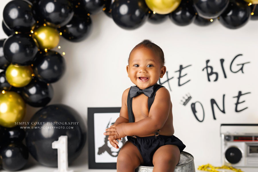 Tyrone baby photographer, black gold balloon garland for Big One studio theme