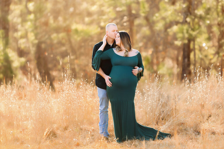 Powder Springs maternity photographer, couple outside in tall grass